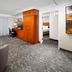 Courtyard by Marriott San Antonio Lackland guest room with seating area, desk, and wardrobe