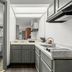 Baymont by Wyndham Tuscaloosa bathroom with tub-shower, toilet, vanity and kitchenette sink