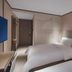 Hanting Hotel Nanjing Hunan Road guest room with two beds and wall lights in Nanjing