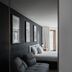Hôtel Lac Carling Golf & Spa guest room in Grenville with dark sofa, bed, and balcony door