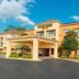 Courtyard by Marriott Tuscaloosa hotel exterior with covered entrance and clear blue sky