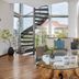 Living Hotel Prinzessin Elisabeth Munich lounge with spiral staircase, curved sofa and glass coffee table