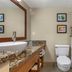 Comfort Inn & Suites Glen Mills - West Chester bathroom with granite vanity, toilet and tub-shower combo