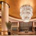 The Westin Wuhan Wuchang lobby with grand chandelier, tall columns and polished marble flooring in Wuhan