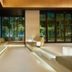 MGH Mitsui Garden Hotel Taipei Zhongxiao lounge with illuminated seating and floor-to-ceiling forest views in Taipei City