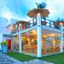 Arugambay Roccos in Arugam, seaside restaurant with open-air terrace and palm trees