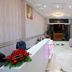 Appart Hotel Mouna Marrakech lobby reception with white desk, pink chairs and potted plants