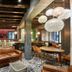 Le Moulin de la Wantzenau in La Wantzenau lounge with leather chairs, round tables and pendant lights