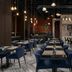Four Points by Sheraton Izmir restaurant dining area with blue chairs and pendant lights in Izmir