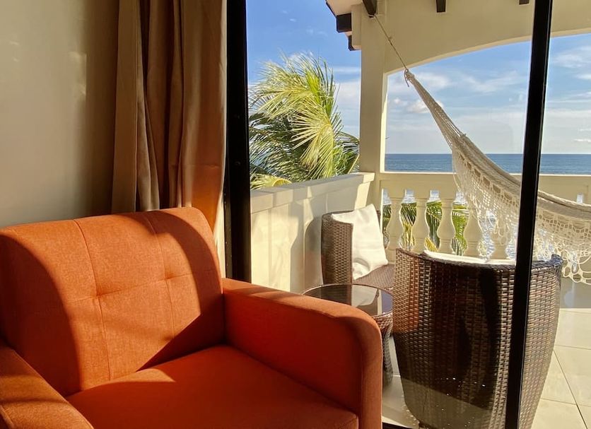 Vista Las Olas Resort in El Cuco: balcony with hammock and ocean view from room