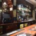 Tongadale Hotel in Portree bar interior with long counter, stocked shelves, and stools