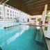 Glory Place Hua Hin indoor pool with tiled deck, lounge chairs and covered open-air roof