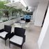 Blu Hotel by Tamaca in Santa Marta, balcony seating area overlooking tropical gardens