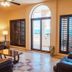 Sea of Cortez Beach Club San Carlos living room with ocean view through arched balcony doors