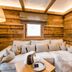 Hotel Leitenhof 4 Sterne Superior in Scheffau am Wilden Kaiser: cozy wood-paneled suite with L-shaped sofa bed