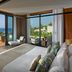 Mandarin Oriental, Bodrum room with sea-view balcony and lounge chair overlooking the water
