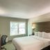 Baymont by Wyndham Lake Park Valdosta I75 guest room with king bed, desk, and window in Lake Park