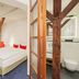 Tailormade Hotel Rüden Schaffhausen room with exposed beams, king bed and open bathroom, Schaffhausen