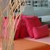 Aparthotel Fleming 50 - Adults Only lounge chair with bright pink cushions in Sant Antoni de Portmany