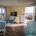 Nauset Beach Inn in Orleans with ocean-view room, large windows, and access to a beachside patio