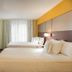 Residence Inn by Marriott Denver Central Park guest room with two beds and TV in Denver