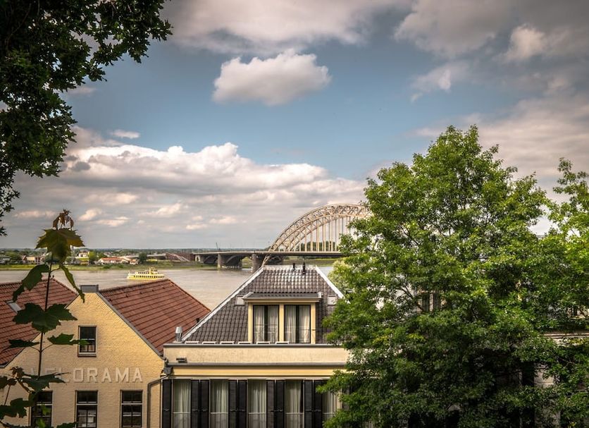 Hotel Courage Nijmegen rooftops with river view and bridge in Nijmegen