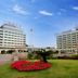 Jinshan Hotel Shanghai exterior with landscaped garden and twin hotel buildings