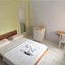 Hotel Dez De Julho room in Manaus with bed, mini fridge, chair and desk