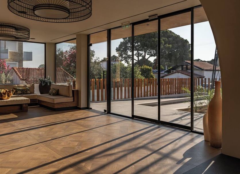 Eleonas Boutique Hotel & Spa in Ialysos lounge with floor-to-ceiling glass doors and outdoor terrace view