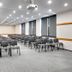 Boutique Hotel's Kwiska - Legnicka meeting room in Wrocław with rows of chairs and projector