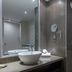 DoubleTree by Hilton Stratford upon Avon bathroom with vessel sink, mirror, and tiled shower area