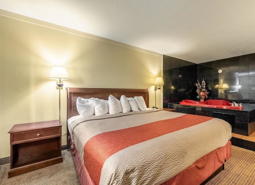Motel 6 Gatlinburg Smoky Mountains room with king bed and in-room spa tub in Gatlinburg