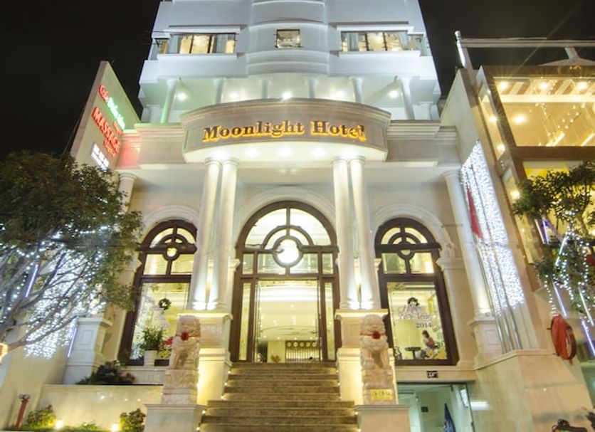 Moonlight Hotel Da Nang tower exterior at night with illuminated entrance in Da Nang