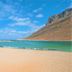 Zorbas Beach Village Hotel in Stavros with sandy beach, turquoise water and rocky mountain backdrop