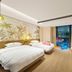 Tian Xing Hotel Chongqing guest room with two beds, wall-mounted TV, and floor-to-ceiling window