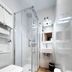 Pensión Régil San Sebastian bathroom with glass shower, sink, toilet and wood-look floor