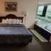 Mackinaw Budget Inn in Mackinaw City guest room with king bed and in-room jacuzzi tub
