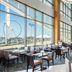 The Westin Washington National Harbor restaurant with Ferris wheel and harbor views in National Harbor