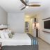 Ein Gedi Kibbutz Hotel in En Gedi room with king bed, ceiling fan, wall TV and pendant light