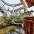 Zhangzhou Yinjia Hotel (Gucheng Branch) courtyard with pond, rocks and spiral stairs in Zhangzhou
