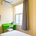 Hi Inn Beijing Shangdi Anningzhuang room with bed, wall TV, desk and window in Beijing