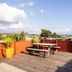 Haka House Taupo rooftop terrace with picnic table and panoramic lake and mountain views in Taupo