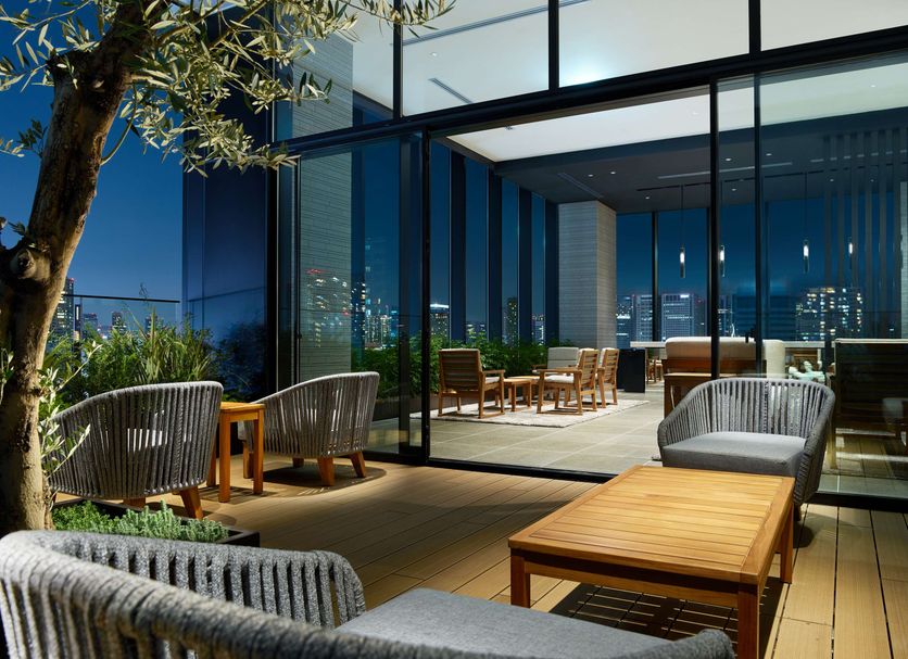 Mitsui Garden Hotel Gotanda in Tokyo rooftop terrace with lounge chairs and city skyline views