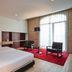 Mercer Casa Torner i Güell in Vilafranca del Penedès: modern hotel room with red rug and floor-to-ceiling window