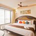 Hotel Sea View in Kanyakumari guest room with king bed, large windows, ceiling fan and natural light