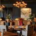 High Country Motor Lodge in Flagstaff lounge with warm pendant lights, wood floors and seating