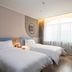 Home Inn Neo Beijing Chaoyang North Road Shilibao Metro Station guest room with two twin beds and desk