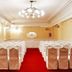 Meeting room at Austral Bahia Blanca Hotel in Bahía Blanca with rows of covered chairs and red carpet
