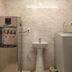 Sin Fu Business Hotel Taichung City utility room with water dispenser, sink, and washing machine