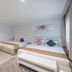 Pratunam City Inn Bangkok triple room with three beds and sofa seating